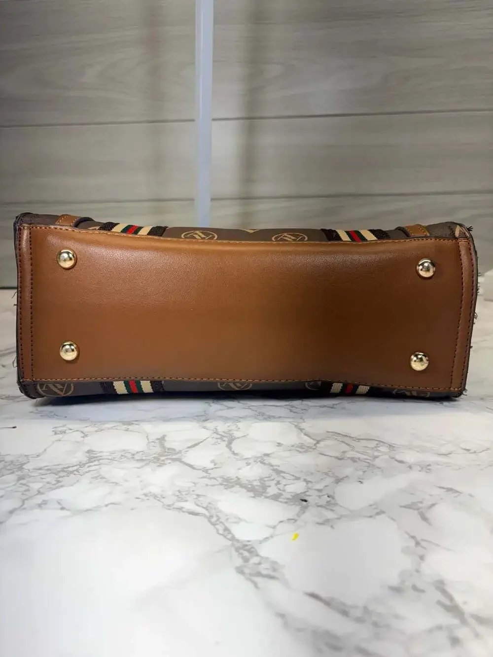 Adrienne Vittadini brown satchel handbag featuring an 